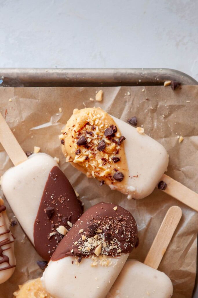 banana popsicles with a peanut butter magic shell