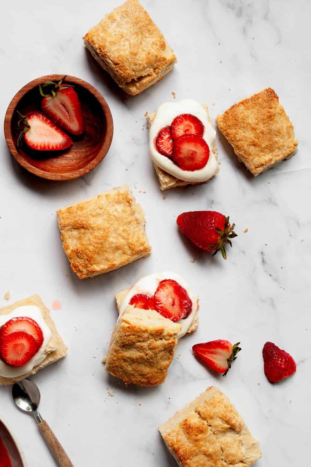 Classic gluten-free strawberry shortcakes with whipped cream and strawberries.