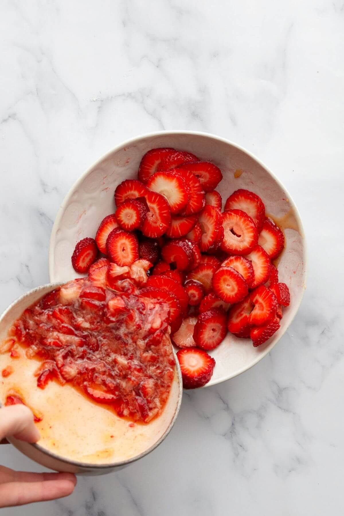 Making homemade strawberry compote with fresh strawberries and honey.