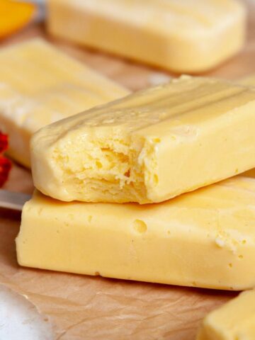 Creamy mango popsicles made with greek yogurt.