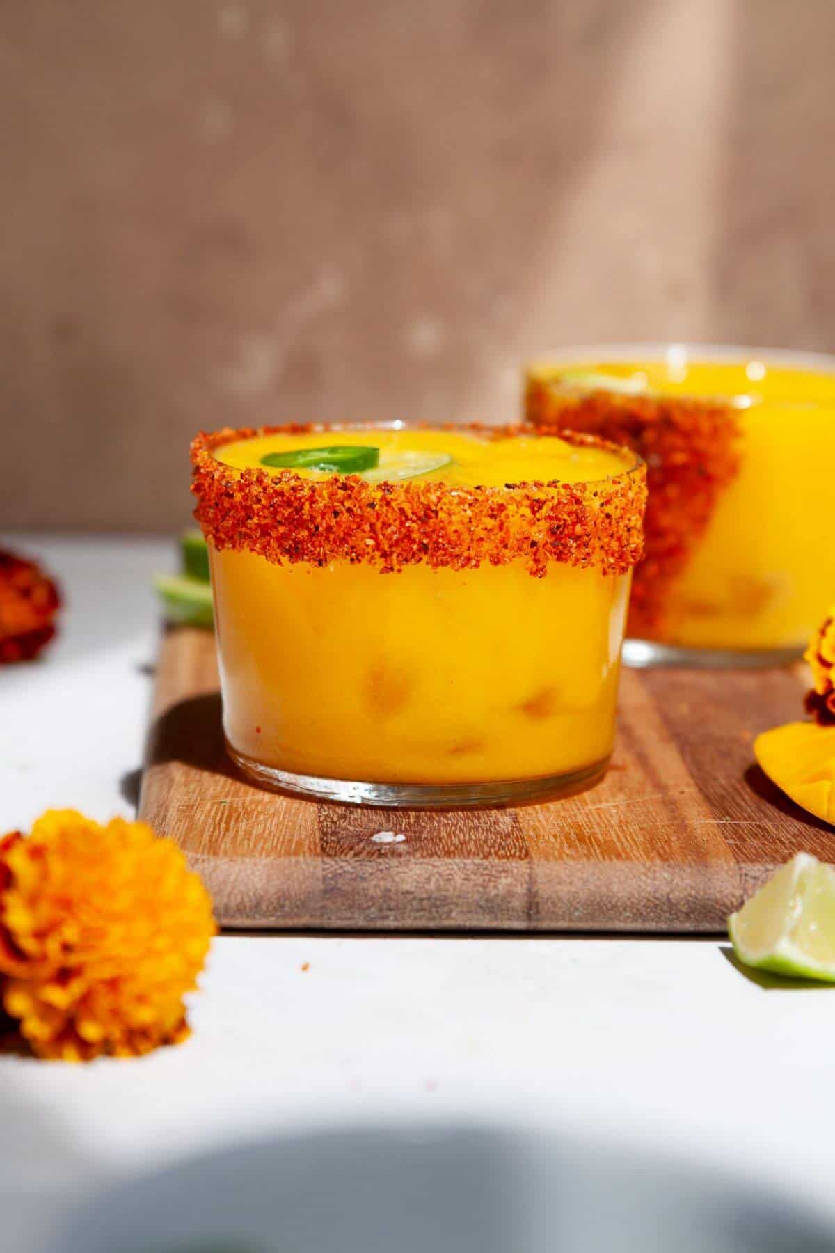 Naturally sweetened spicy mango margarita with a Tajín rim.