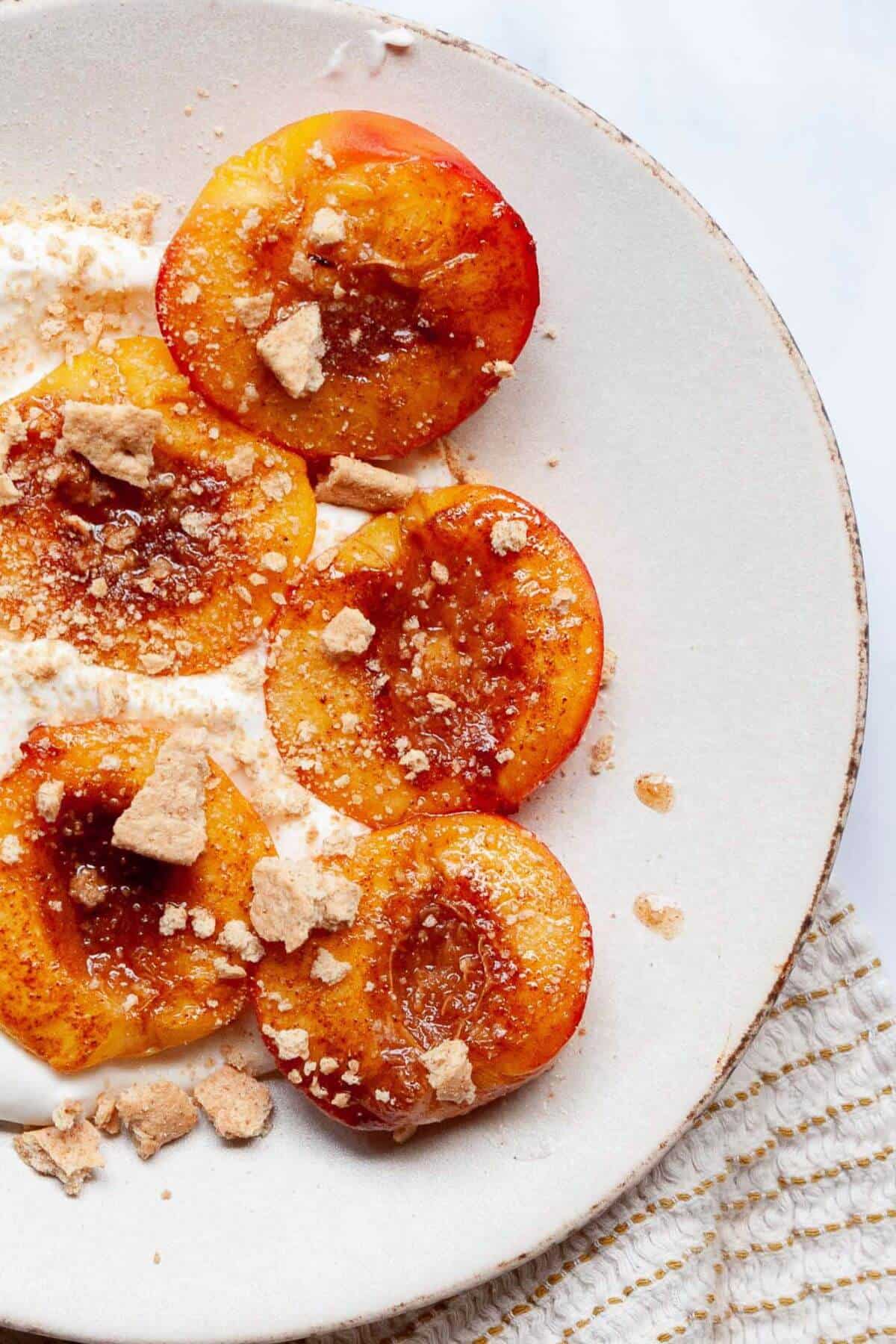 Caramelized maple syrup peaches baked in the air fryer.
