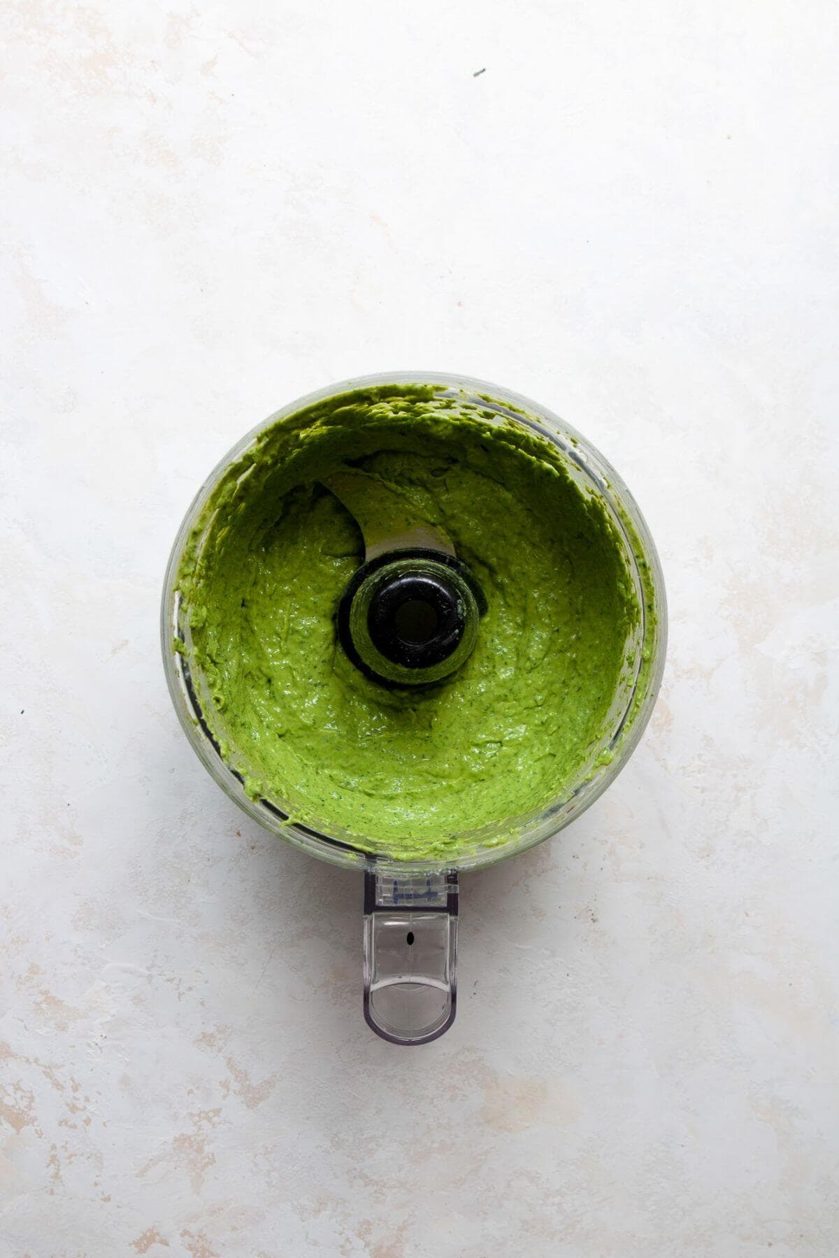 Smooth, creamy green dressing blended in a food processor.