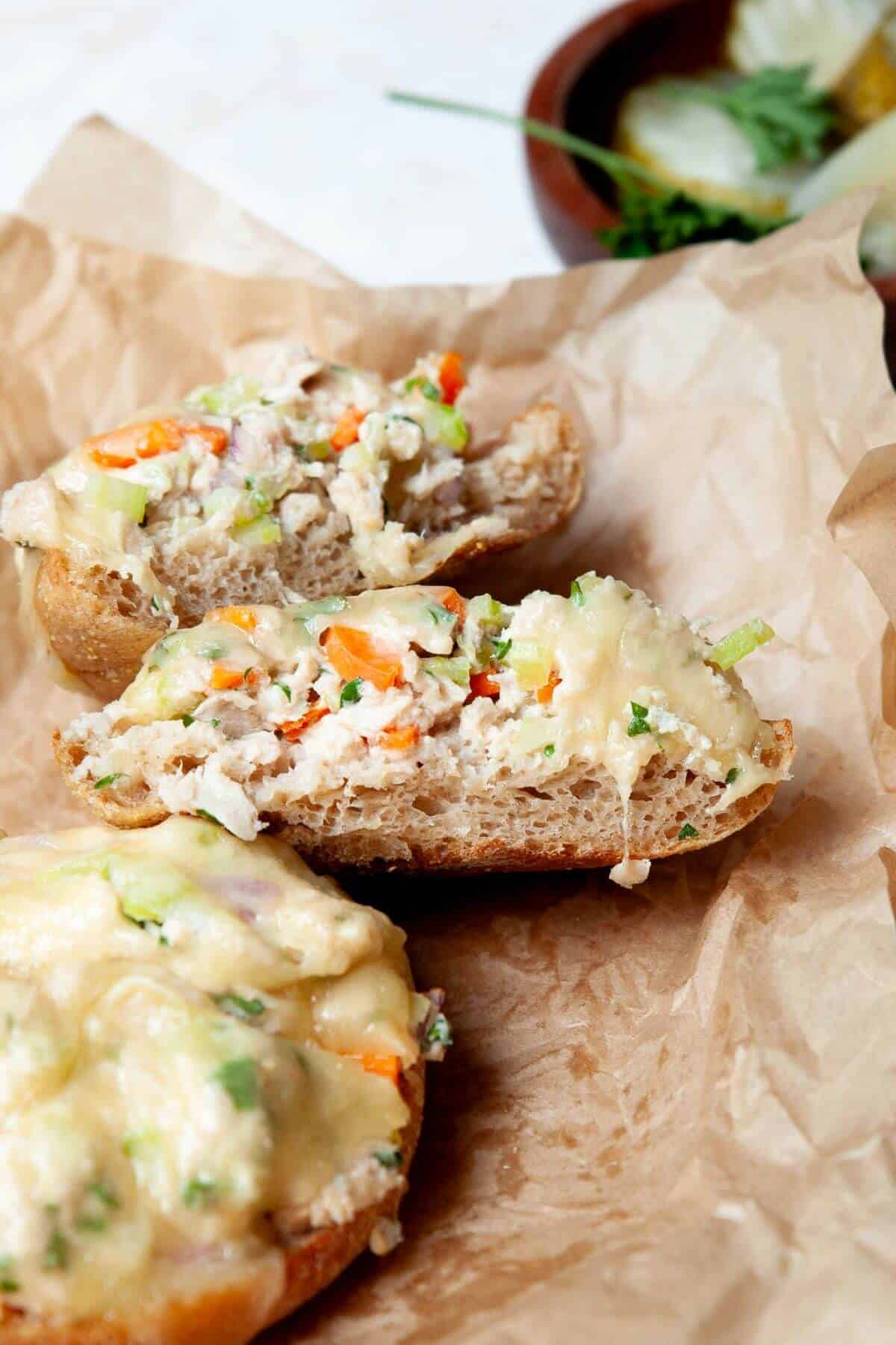Inside of air fryer tuna melt on toasted english muffin and made with homemade, healthy tuna salad.