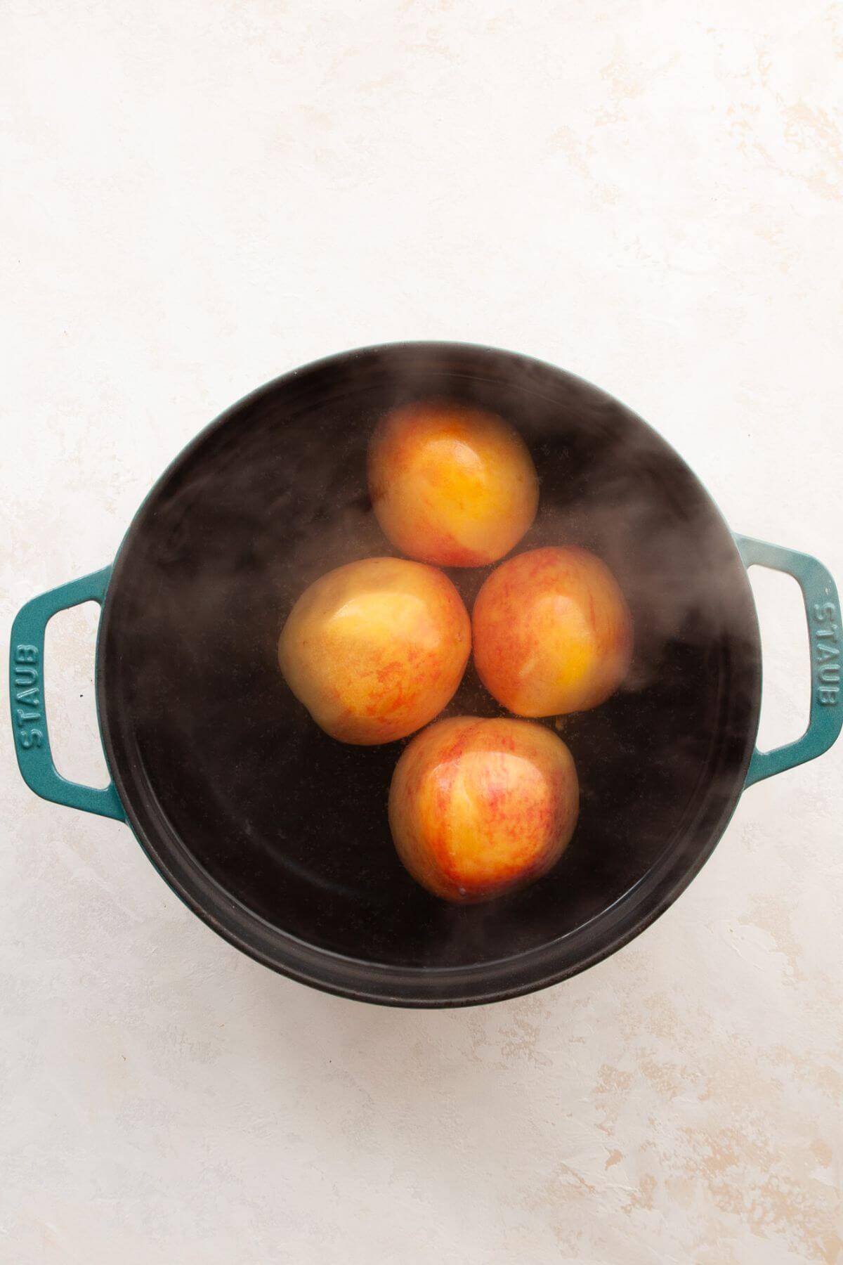 Blanching peaches to remove the skin on firm peaches.