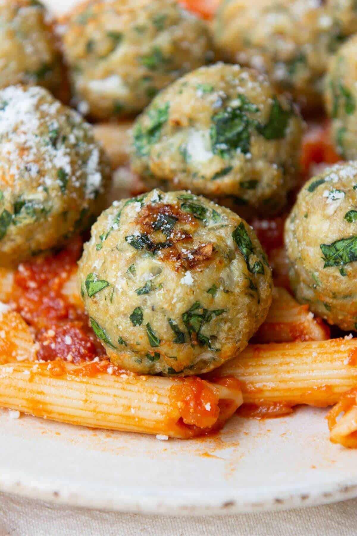 Juiciest air fryer chicken meatballs on a plate.