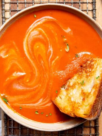 dairy-free and gluten-free tomato soup with a grilled cheese sandwich
