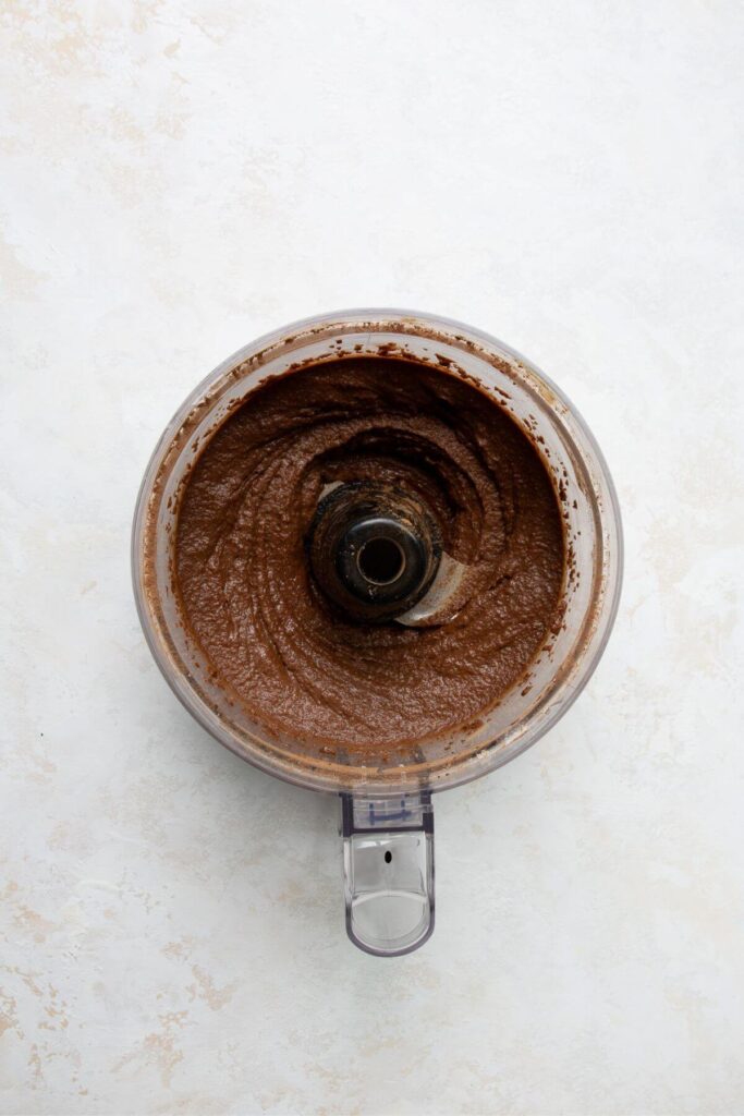 smooth chickpea brownie batter in a food processor