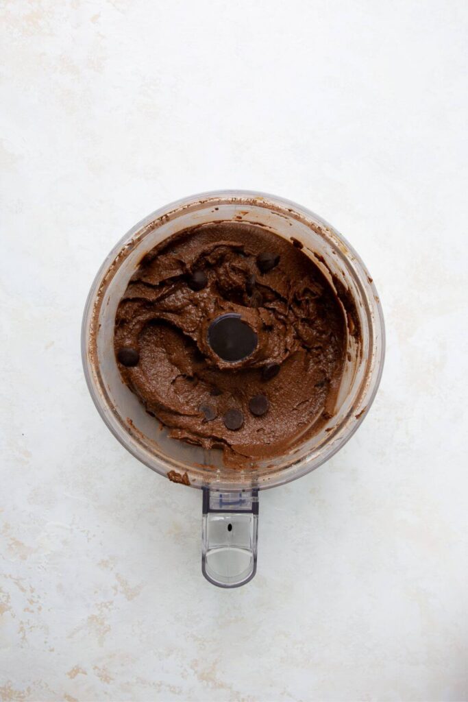 brownie batter in a food processor with chocolate chips