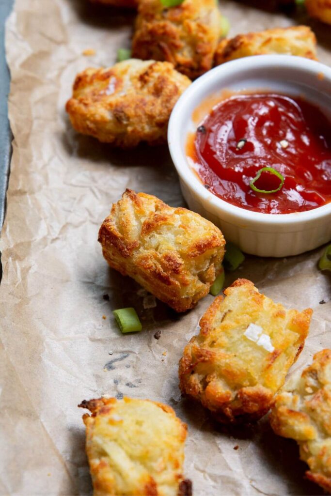 gluten free tater tots with ketchup and green onion