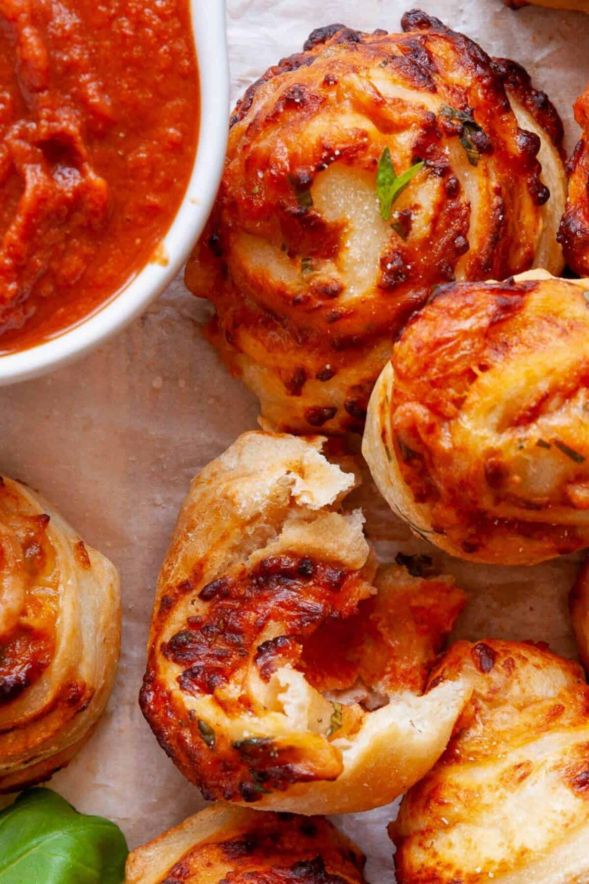 Cheesy and crispy homemade air fryer pizza roll with golden crust and gooey melted mozzarella inside.