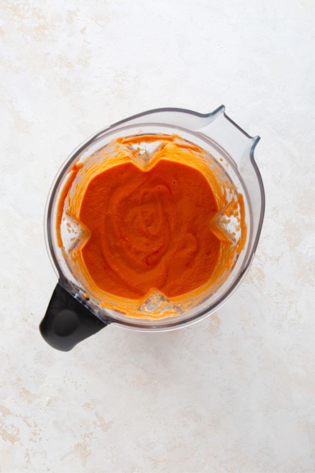 Smooth blush-orange Greek yogurt vodka sauce blended until creamy without heavy cream.