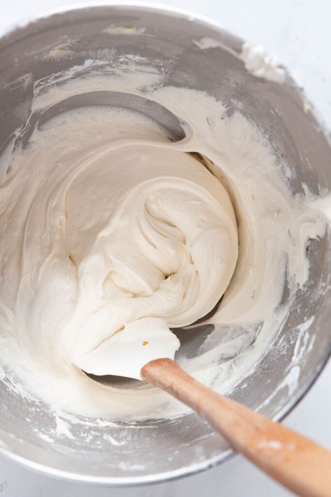 healthy cream cheese and yogurt frosting in a mixing bowl
