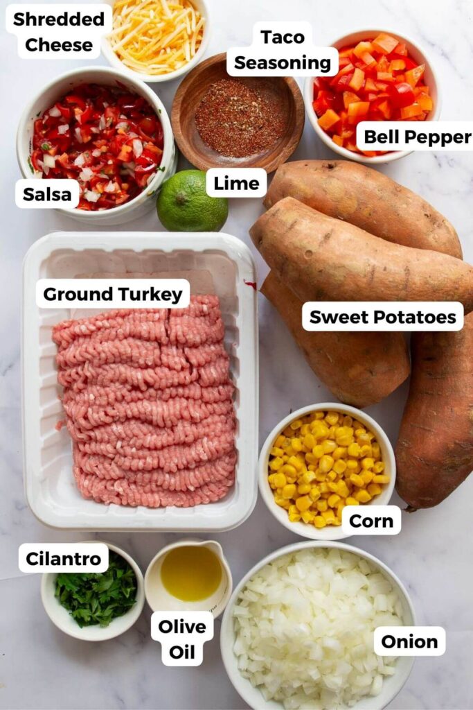 all ingredients in stuffed sweet potatoes in small bowls with labels