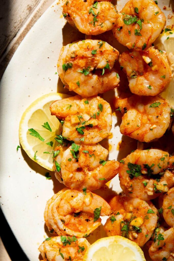 easy shrimp skewers cooking in the oven