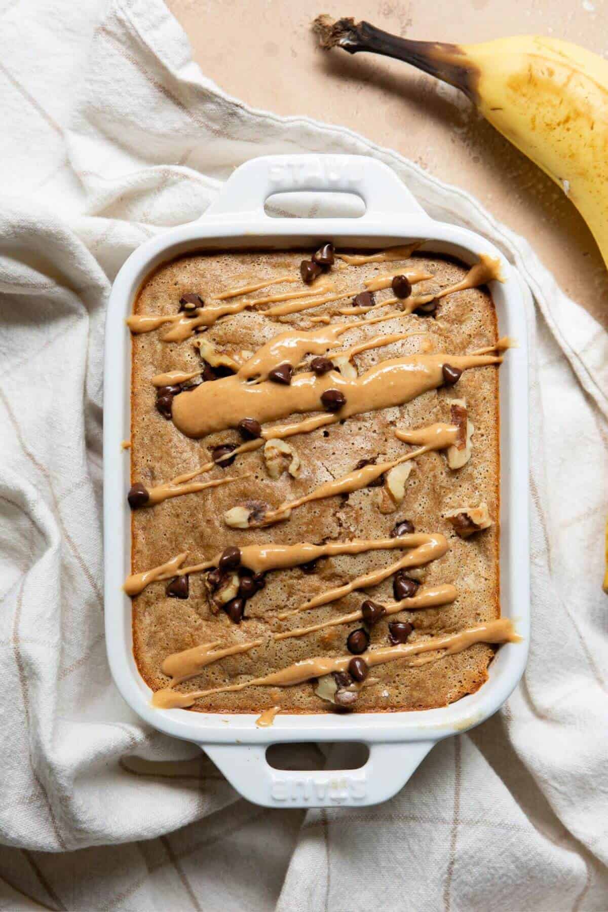 High-protein, healthy single serve banana bread drizzled with peanut butter.