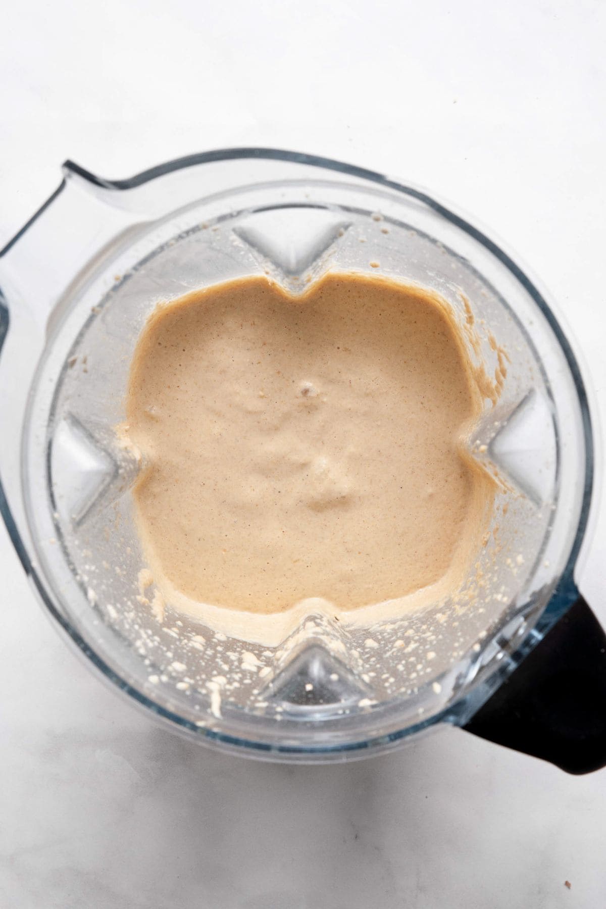 Smooth, thick banana oat pancake batter in a blender after resting for 3 to 5 minutes.