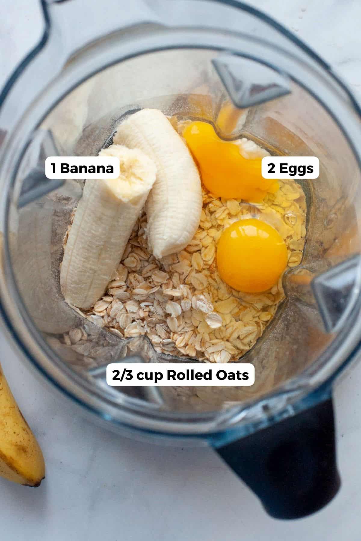All three ingredients in these pancakes labeled, including: banana, rolled oats, and eggs.