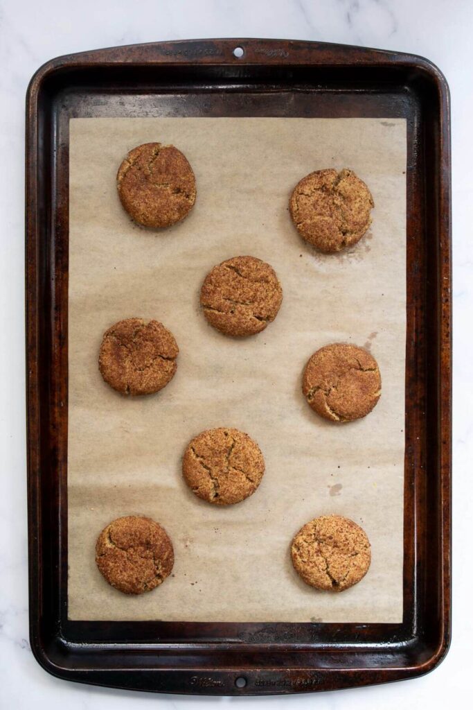 healthy snickerdoodle cookies on a baking sheet