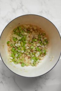 sautéing onions and celery in a pot