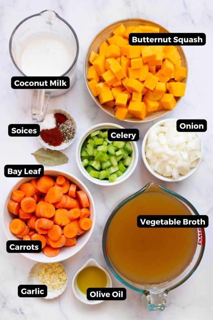 all ingredients in carrot and butternut squash soup in small bowls with labels