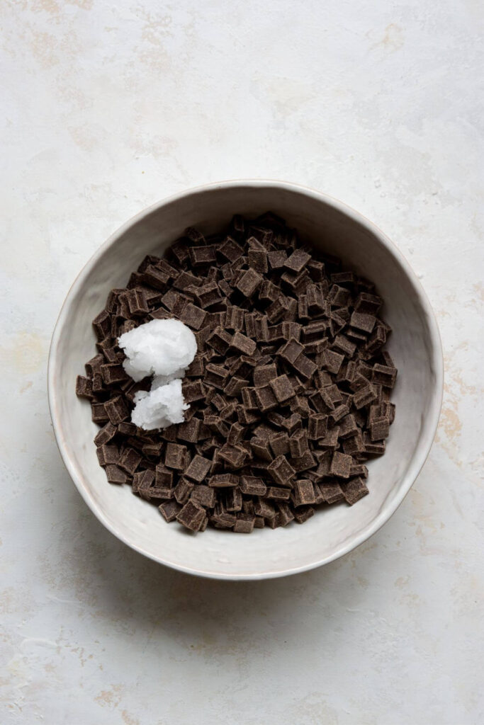 dark chocolate chip in a bowl with coconut oil