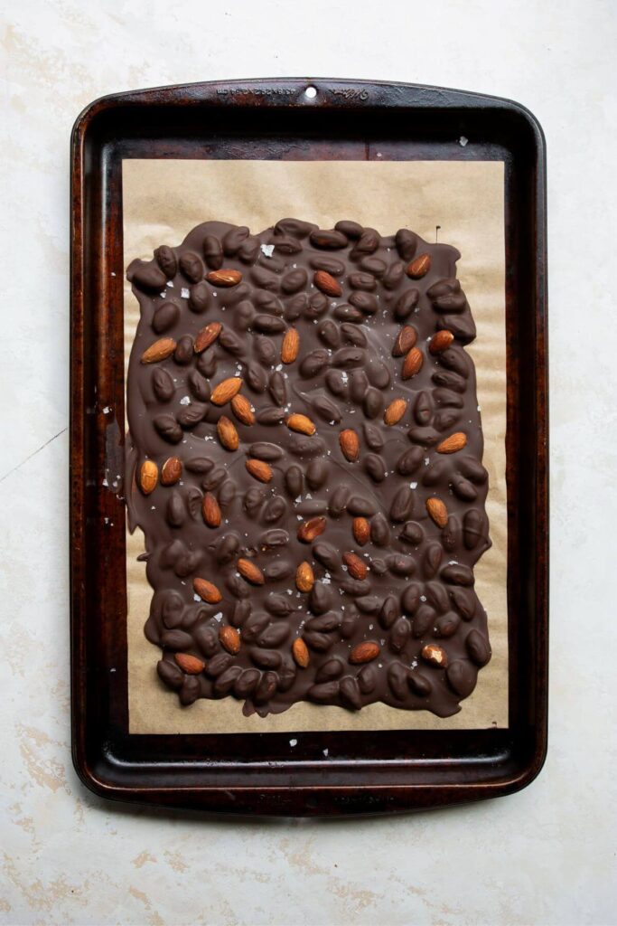 chocolate almond bark frozen on a baking sheet
