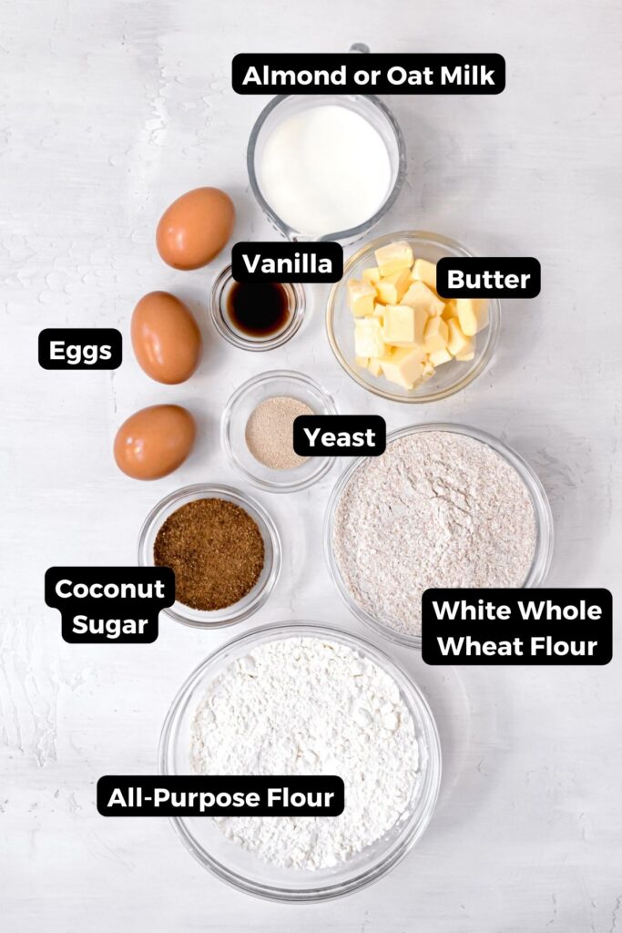 all ingredients in healthy cinnamon roll dough in small bowls with labels