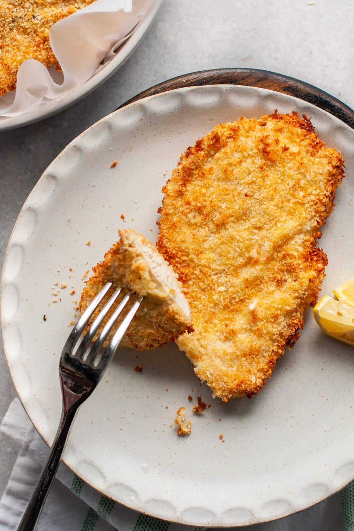 Juicy, crispy breaded air fryer chicken cutlet with golden crust.