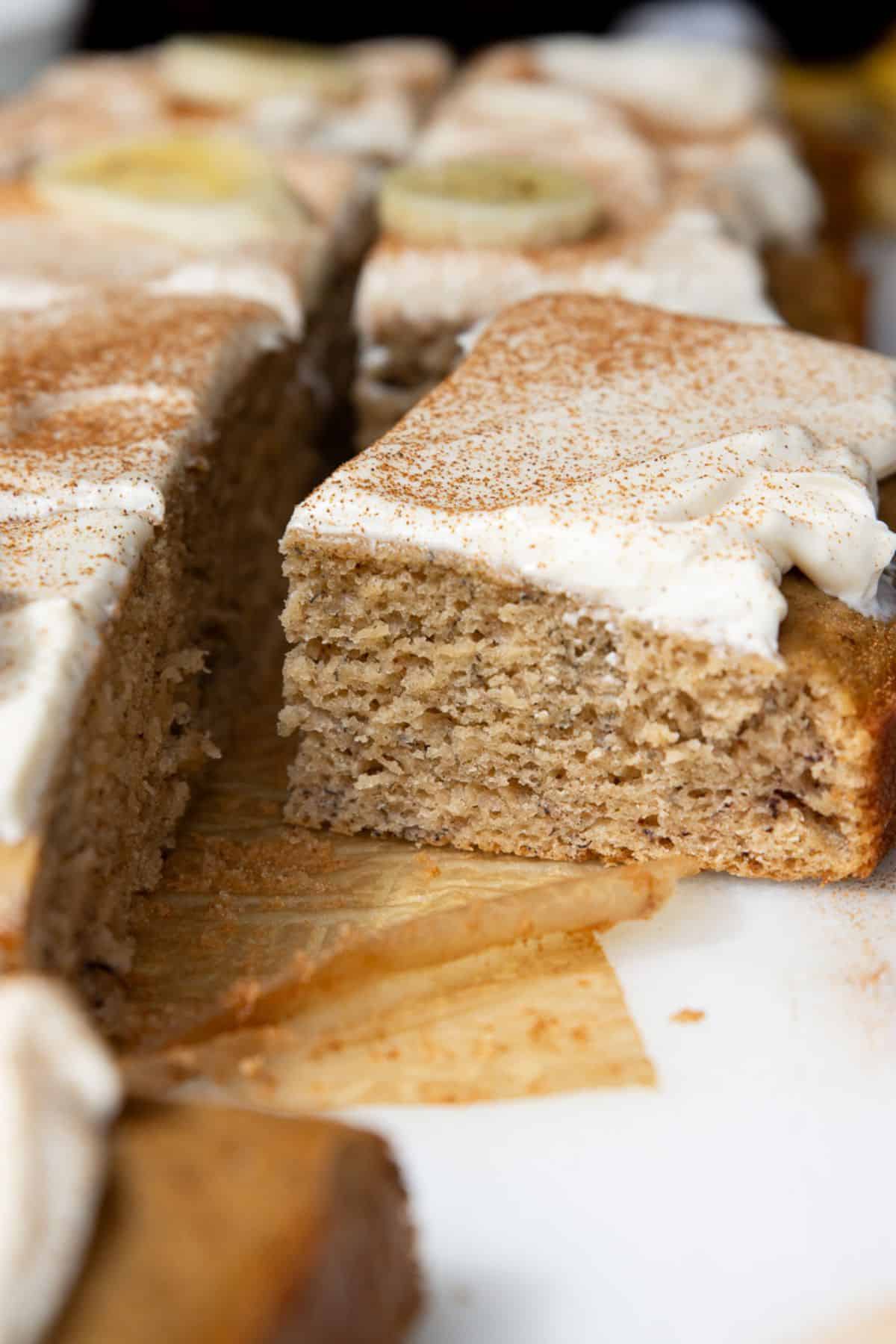 Soft gluten-free banana cake with homemade cream cheese frosting.