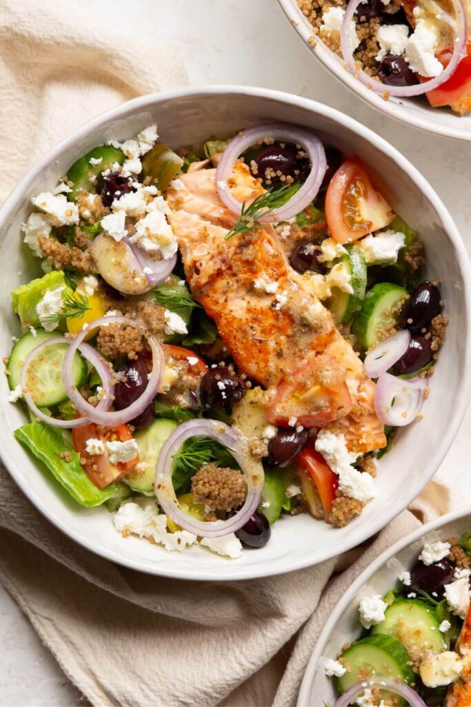 Greek salad with salmon and quinoa