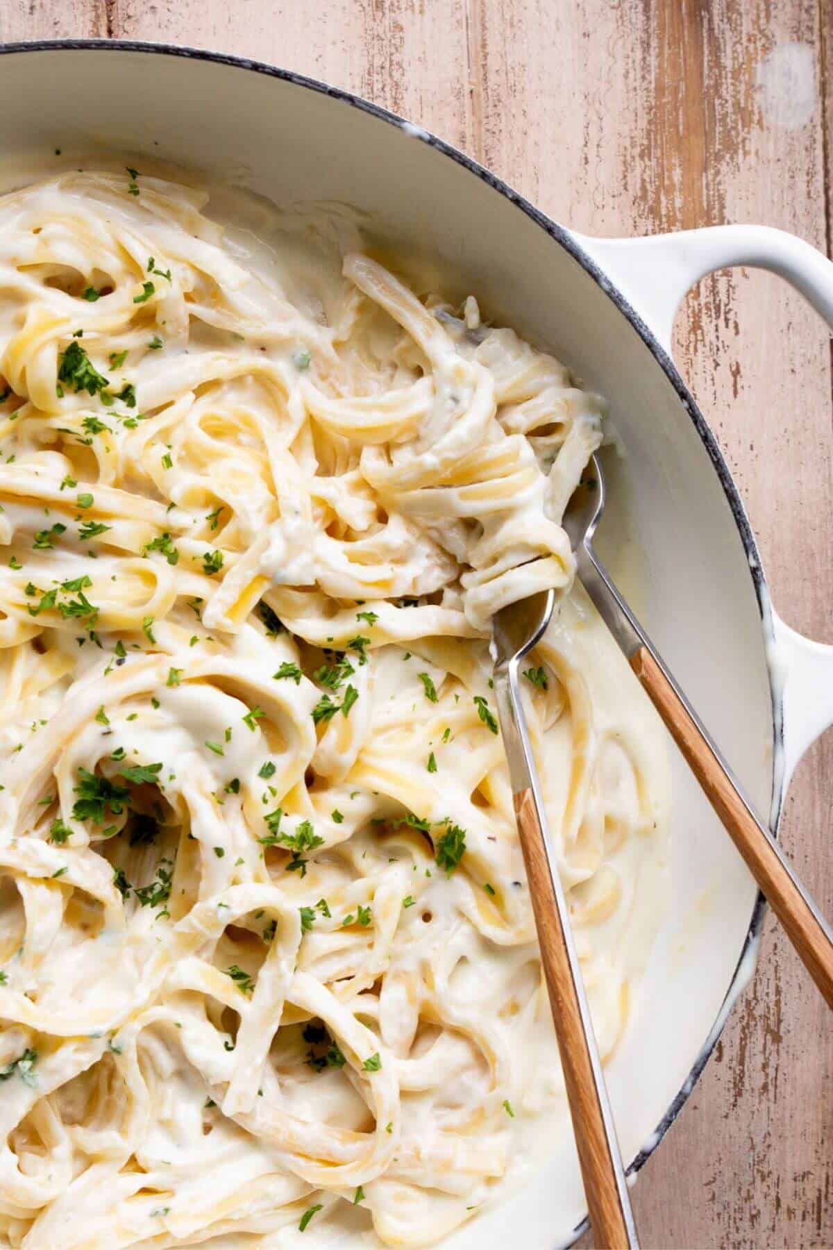 Super creamy, healthy Fettuccine Alfredo sauce made with low-fat cream cheese and skim milk.
