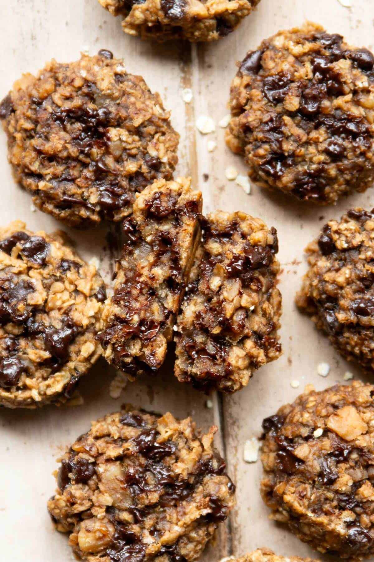 Inside of a banana oat breakfast cookie showing its soft, chewy texture with oats and banana.