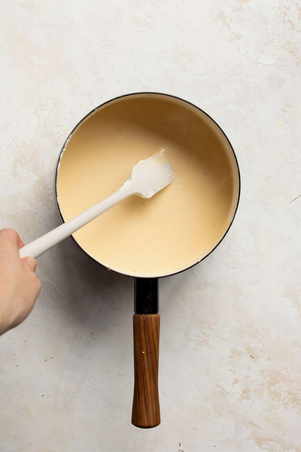 adding cheese and cottage cheese to the sauce