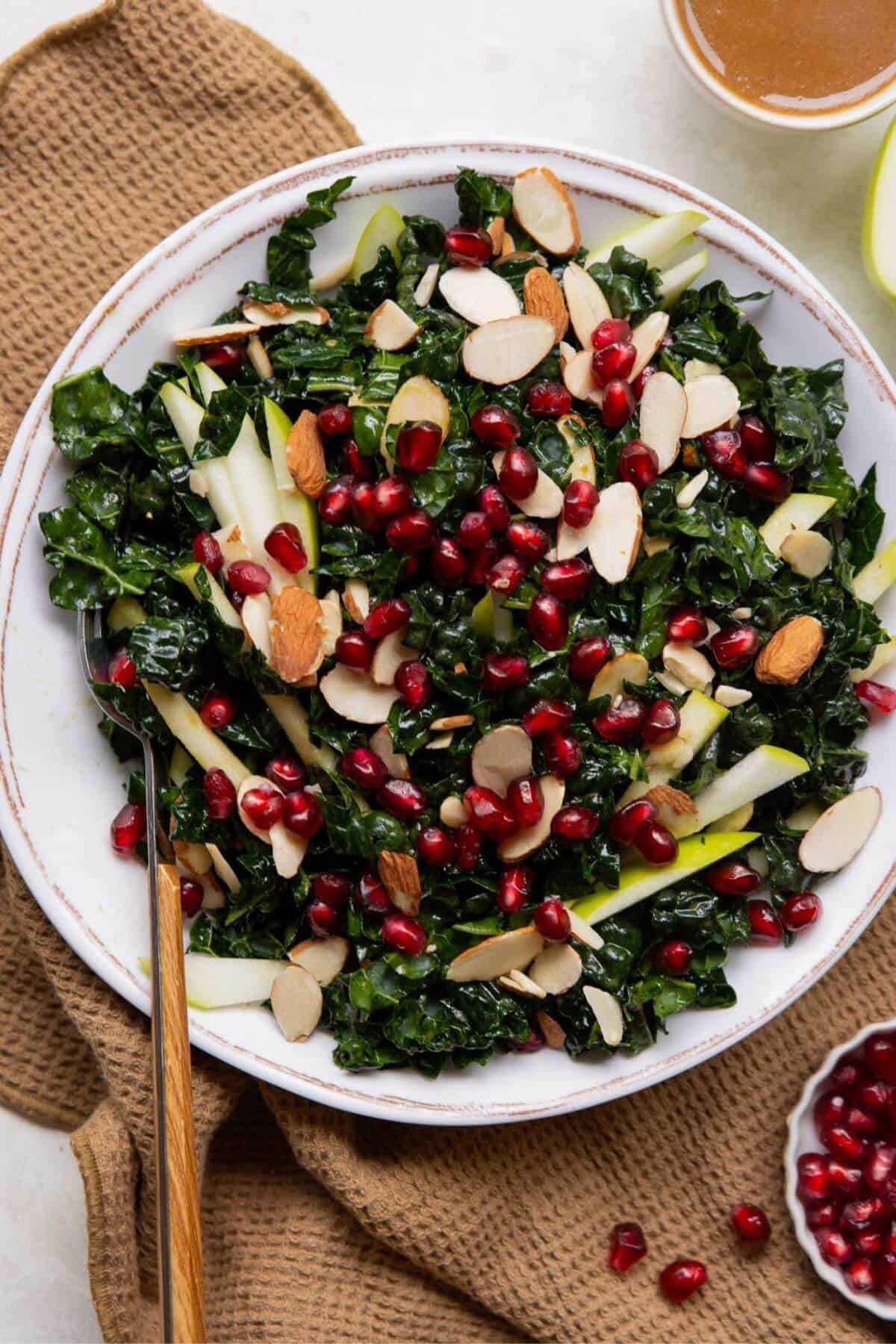 Kale salad with green apple, pomegranate, and almonds.