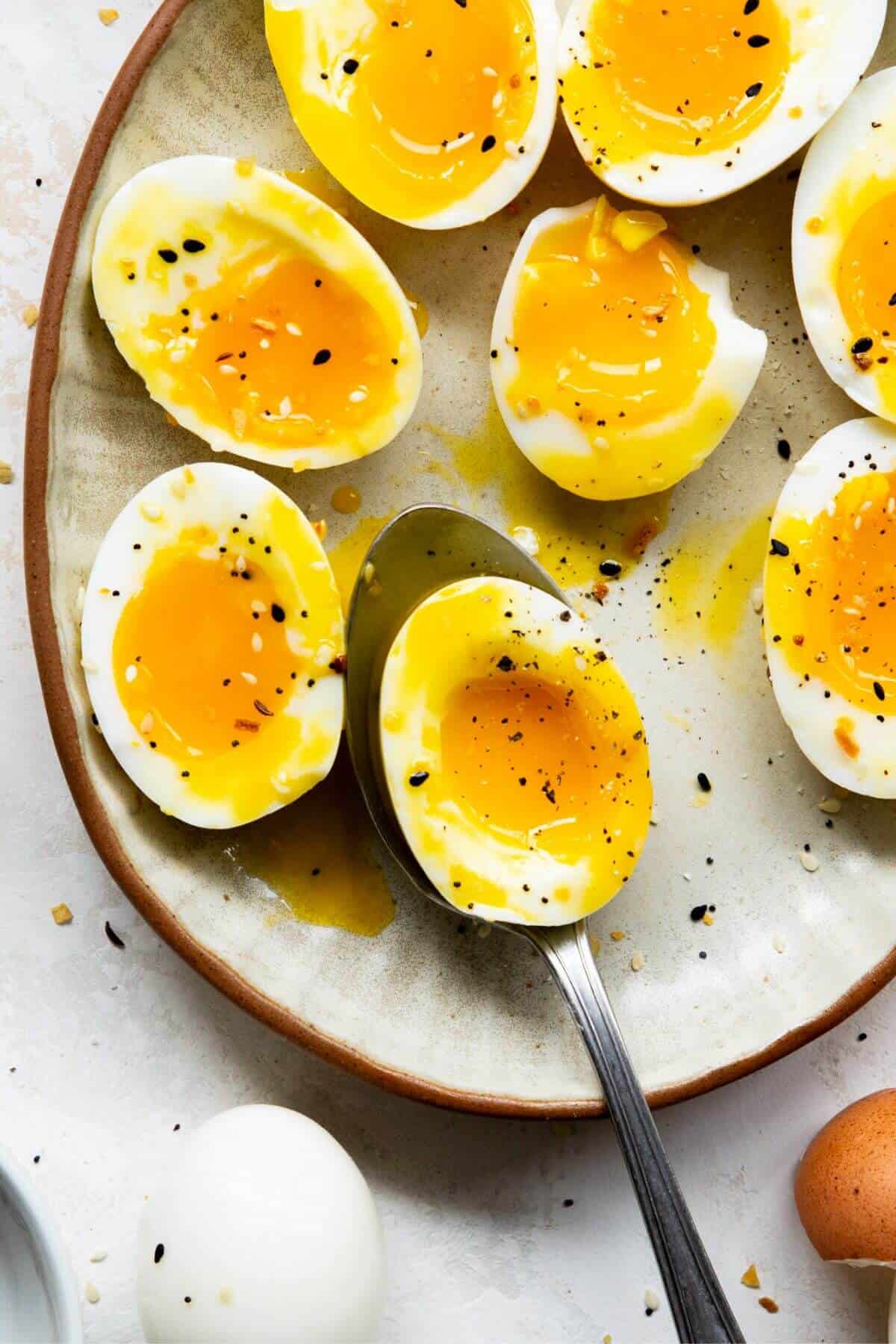 Close up of air fryer soft boiled eggs with jammy yolks and set whites.