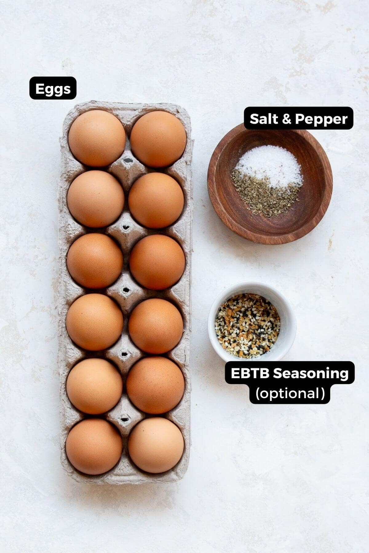Ingredients for air fryer soft boiled eggs including eggs, salt and pepper, and everything bagel seasoning.