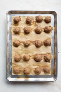 cooked turkey meatballs on a baking sheet