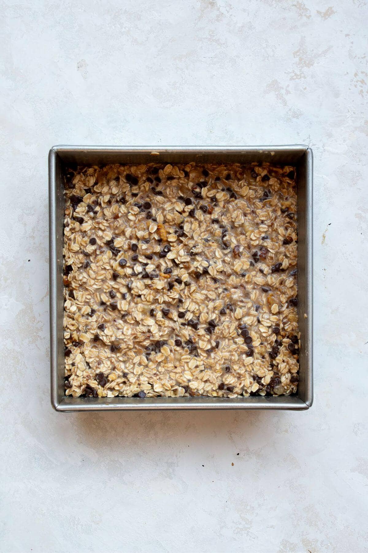 Uncooked vegan baked oatmeal in a baking dish.