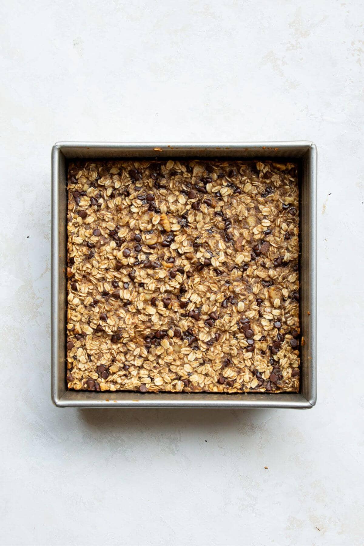Soft and tender vegan baked oatmeal in a baking dish.