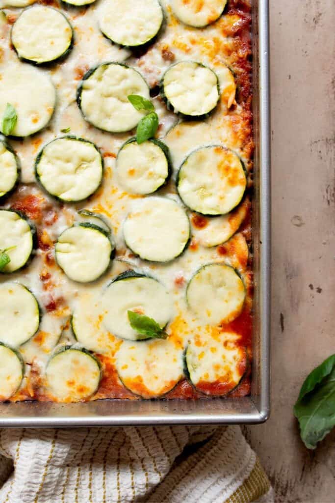 close up of beef and zucchini casserole in baking dish