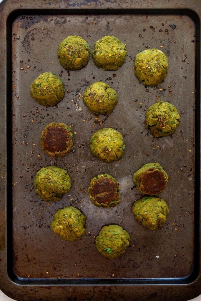 crispy homemade sweet potato falafels baked on a sheet