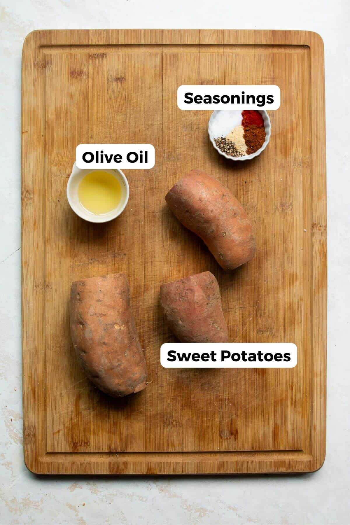 All ingredients in recipe including sweet potatoes, olive oil, garlic powder, onion powder, paprika, and chili powder.
