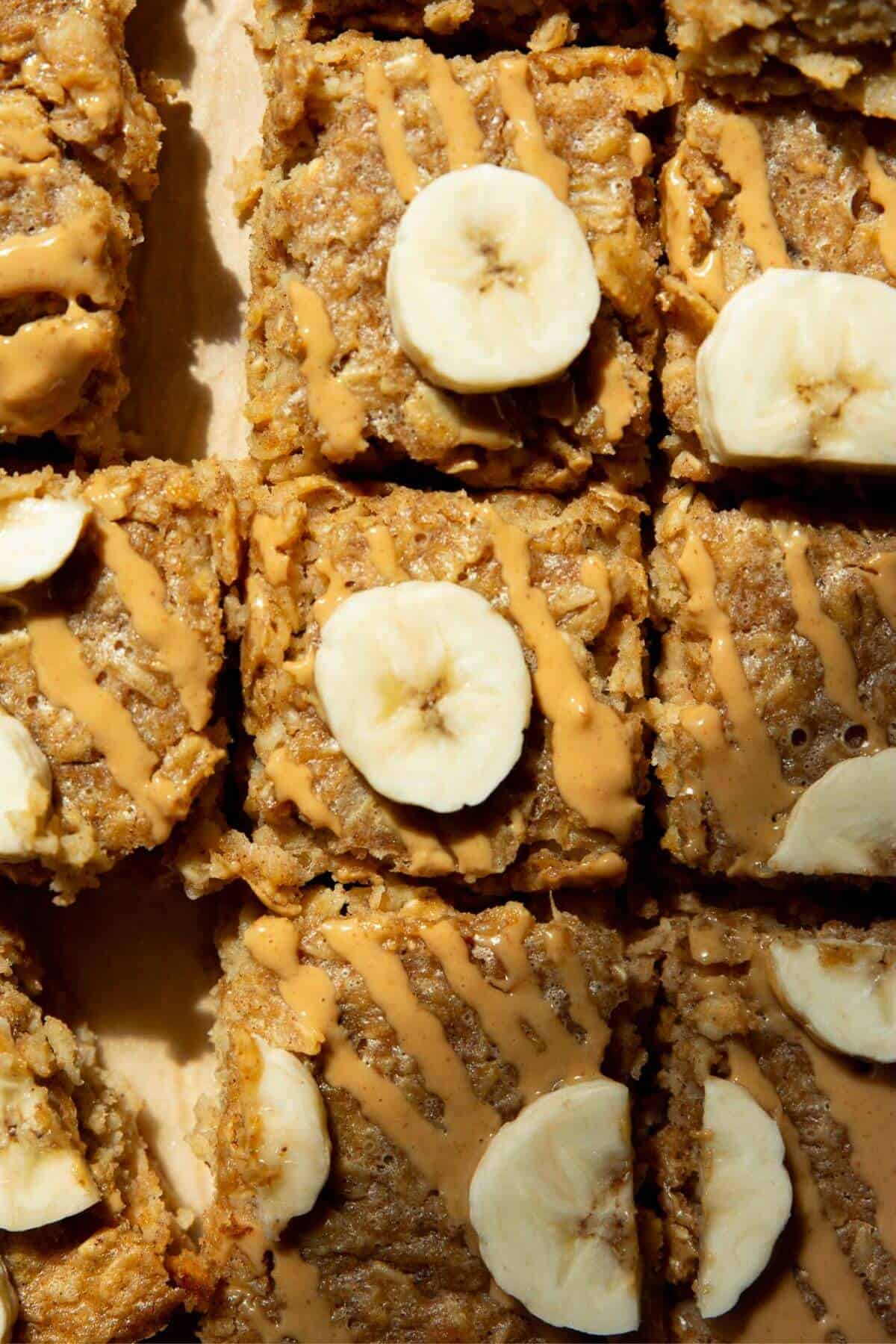 Peanut butter banana baked oatmeal cut into bars for a healthy, make-ahead breakfast or snack.