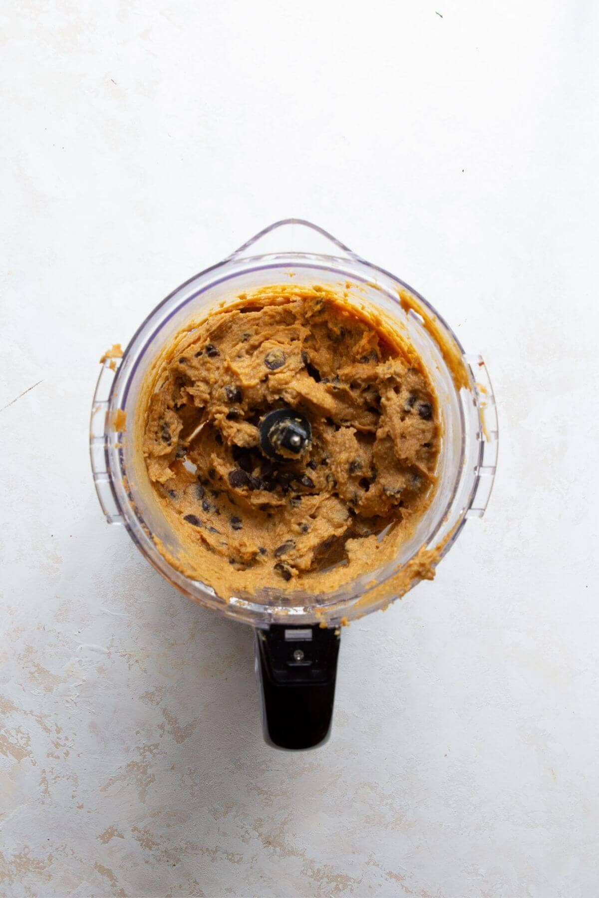 Smooth chickpea blondie batter blended in a food processor.