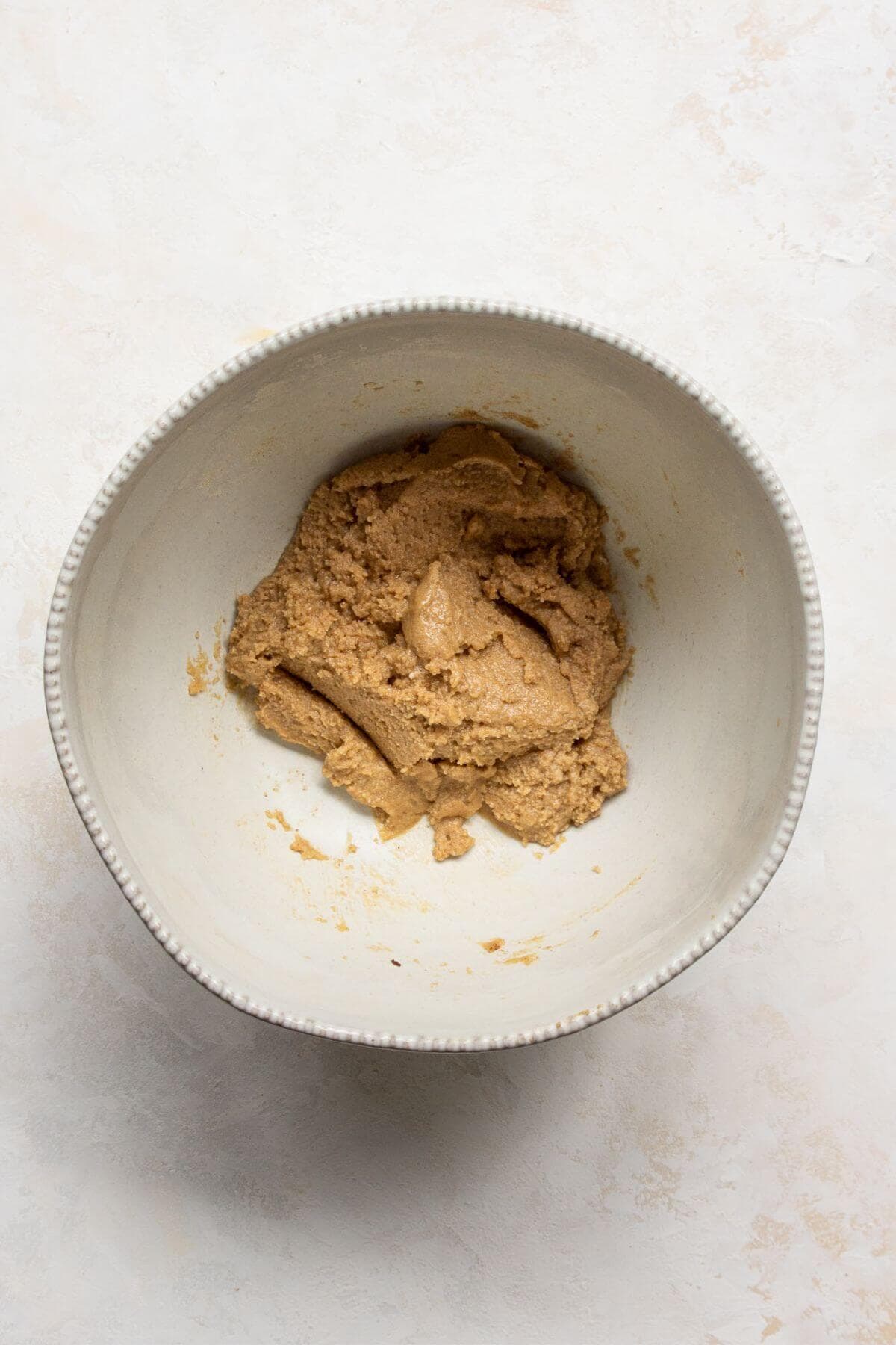 Making the almond flour shortbread crust for blueberry crumble bars.