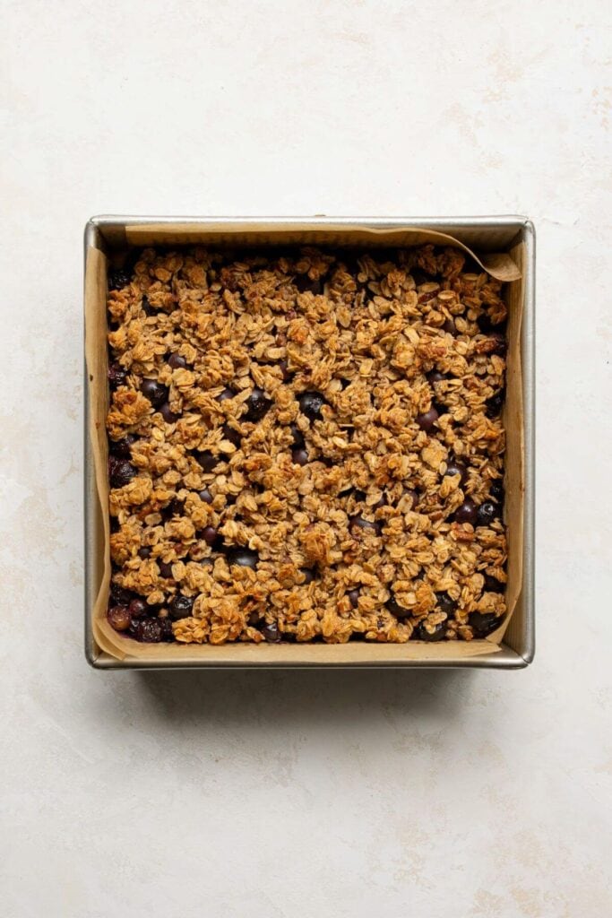 baked healthy blueberry pie crumble bars in an 8x8 inch dish