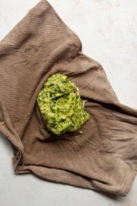 how to squeeze excess water out of grated zucchini