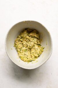 zucchini fritter batter in a bowl