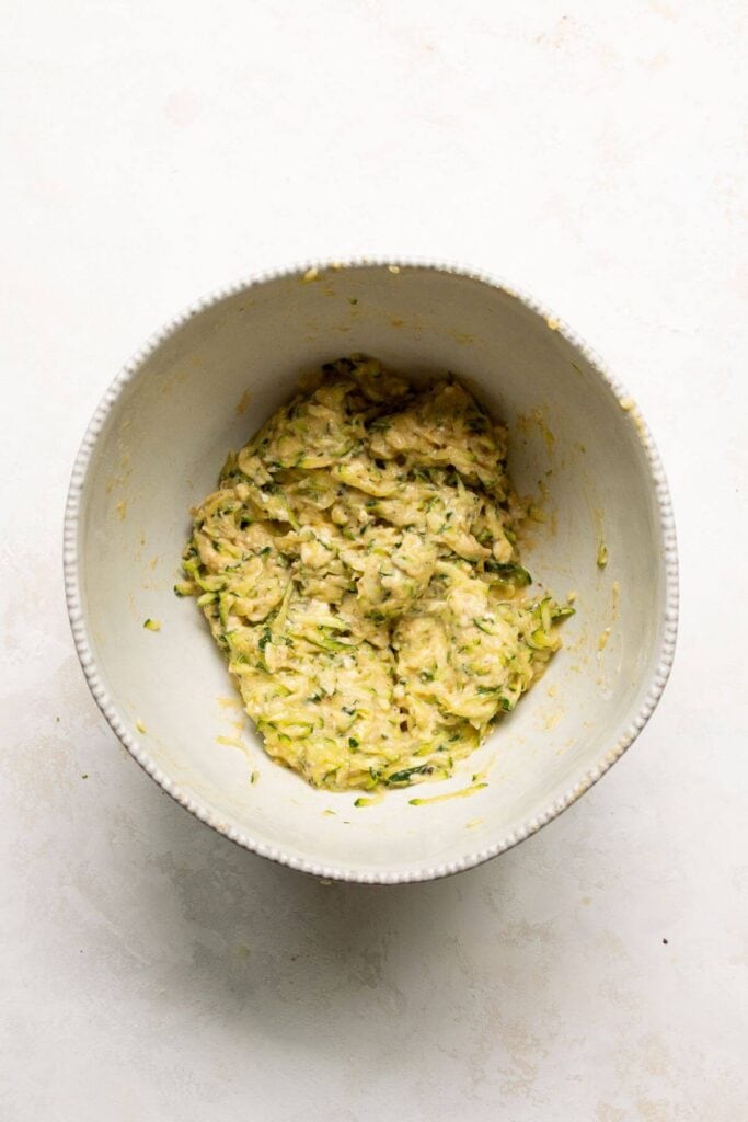 zucchini fritter batter in a bowl